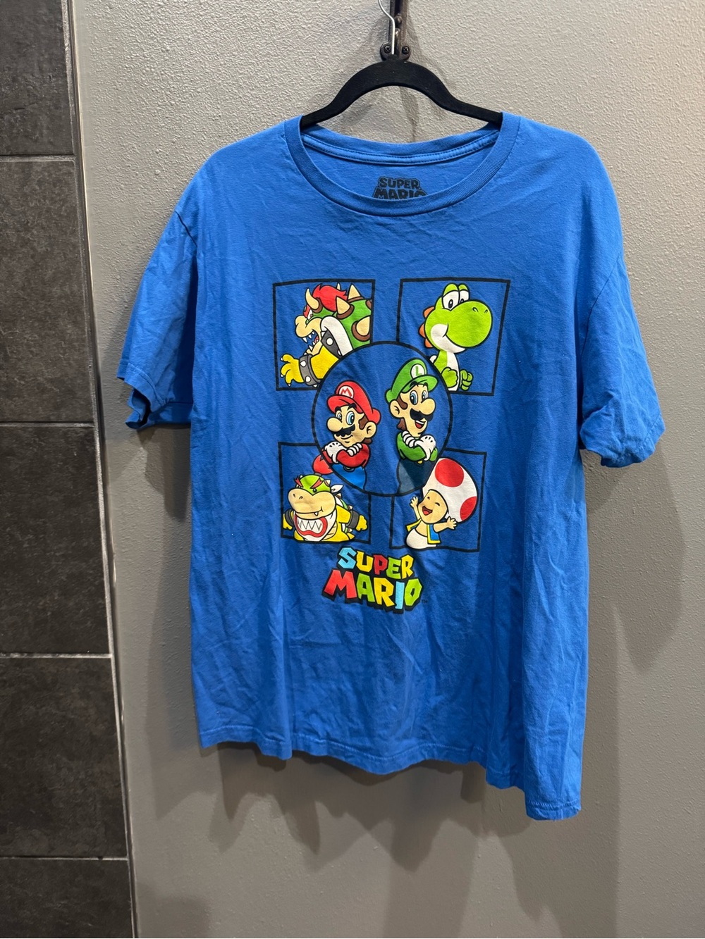 Nintendo Super Mario Blue Short Sleeve Tee with Multicolor Character Print